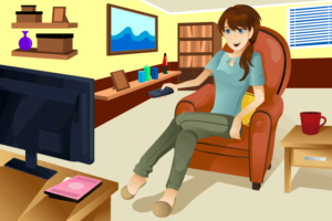 woman sitting in living room watching television